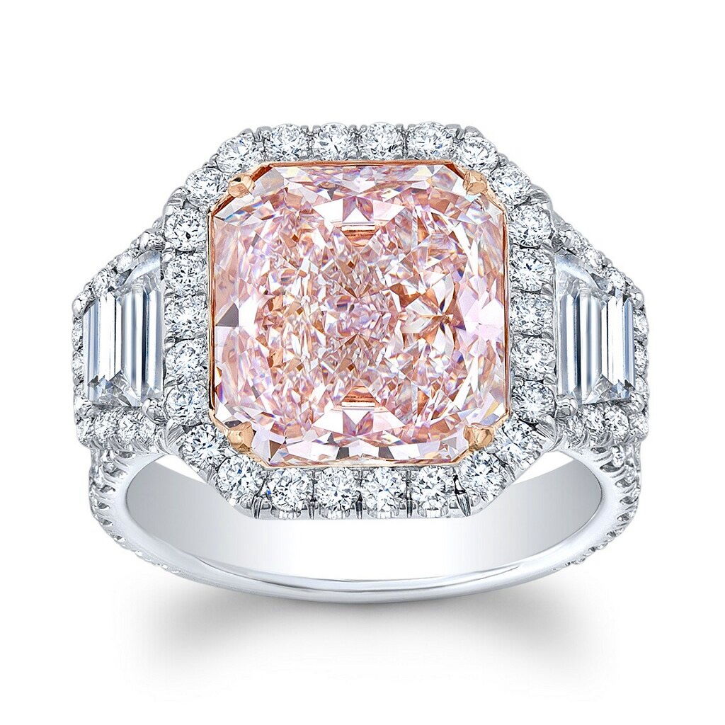 Fancy pink radiant-cut diamond ring with a diamond halo