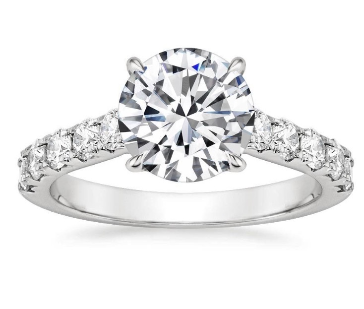 Round brilliant diamond ring with diamond shoulders