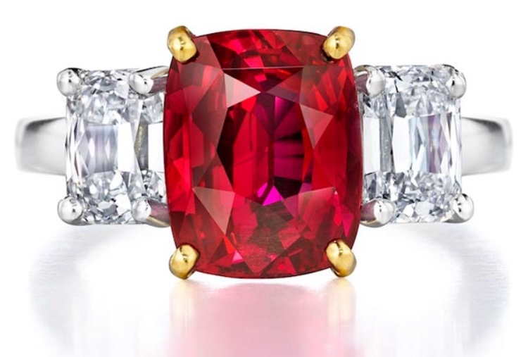 Cushion-cut ruby ring with two diamond side stones